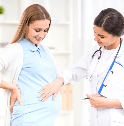 doctor examining pregnant woman