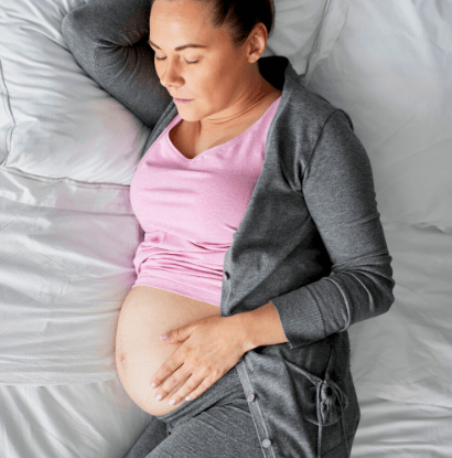 pregnant woman sleeping on her side