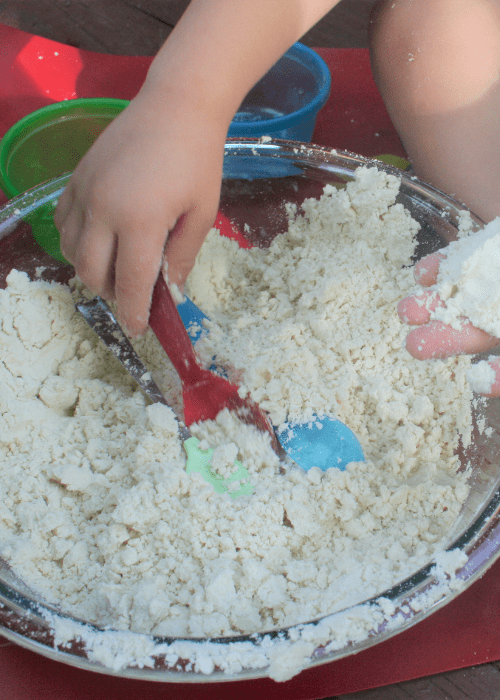 bin with sand and a spoon