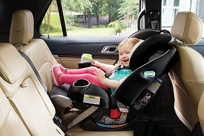 little girl in rear-facing car seat