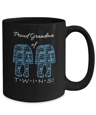 black mug with blue baby clothes