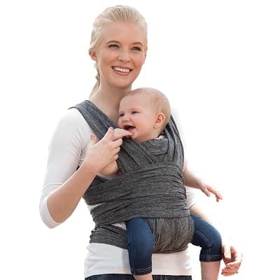 a woman holding an infant in a front facing wrap baby carrier