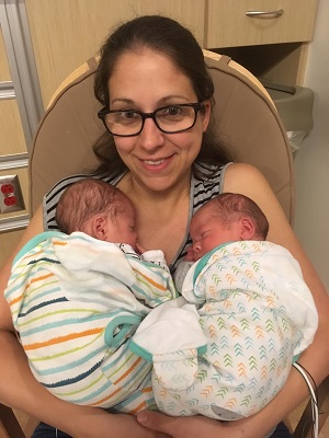A mom holding her newborn twins