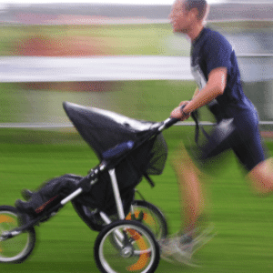 man running with a double jogging stroller