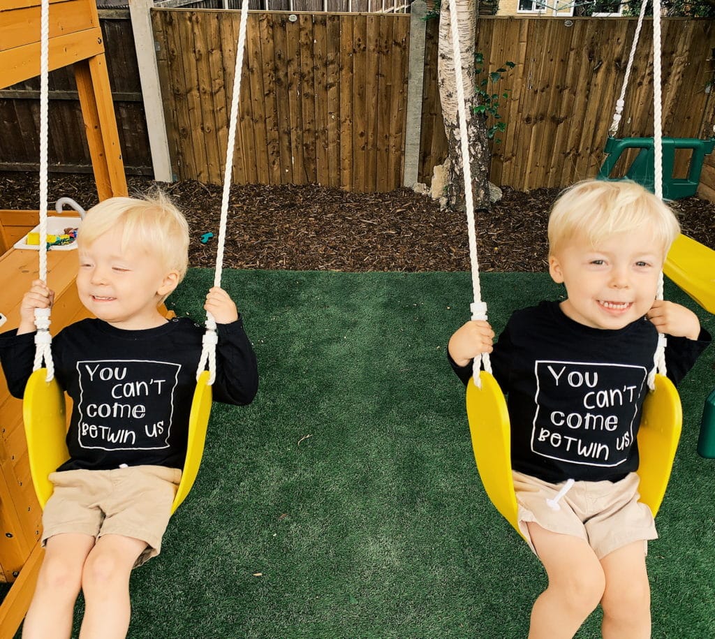 twin boys on swings