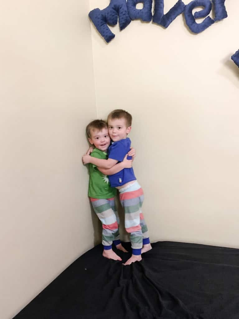 twin boys hugging