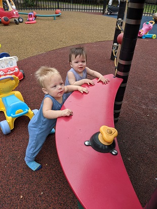 boy/girl twins playing outside