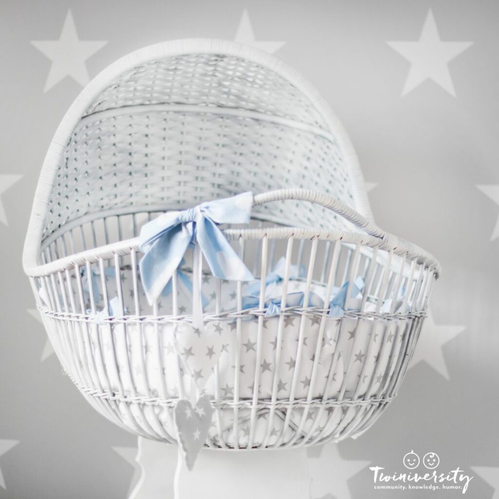 White wicker bassinet with white sheets for baby boy nursery ideas