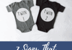 two onesies that say twin 1 and twin 2 Signs of Twin pregnancy