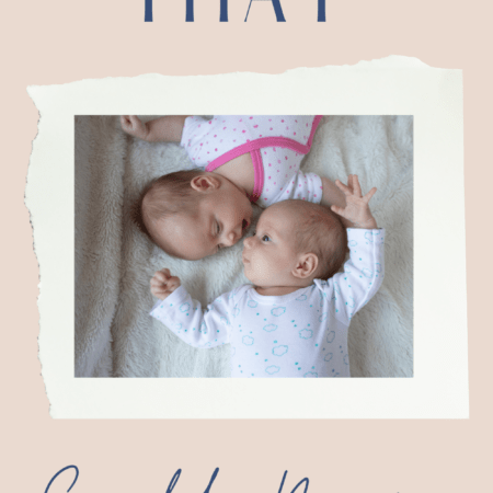 infant twin babies laying on a bed