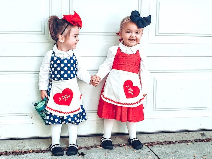 twin girls in lucy and ethel costumes for trick or treat covid style halloween