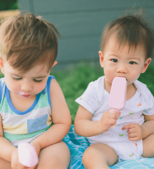 toddlers eating ice cream outside
