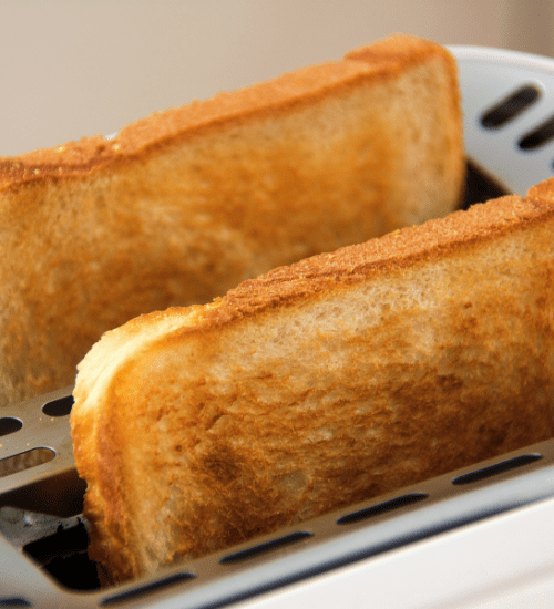 2 pieces of toast popped in a toaster to battle morning sickness