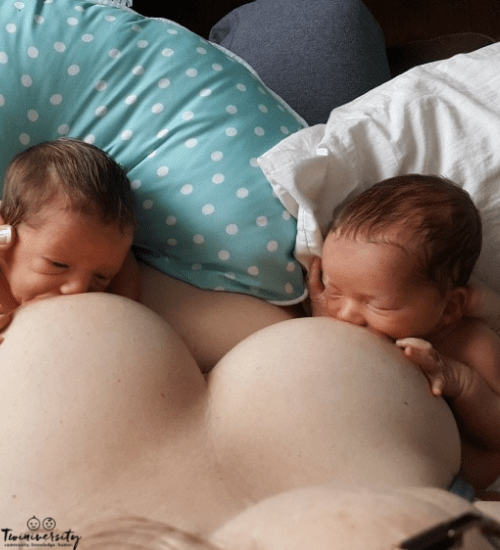 mom breastfeeding twins with no twin breastfeeding pillow