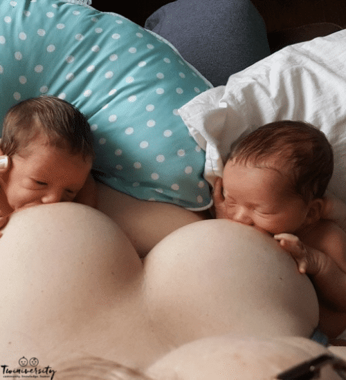 mom breastfeeding twins with no twin breastfeeding pillow