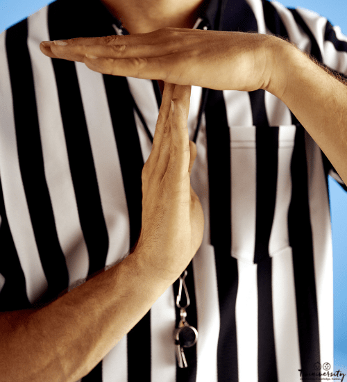 a referee signaling a time out