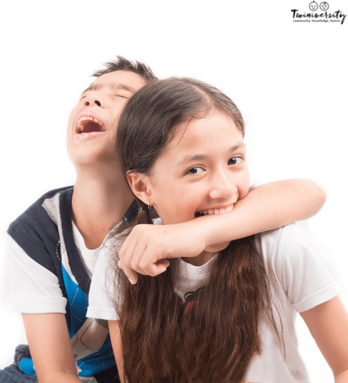 a girl biting a boys arm as twins fight