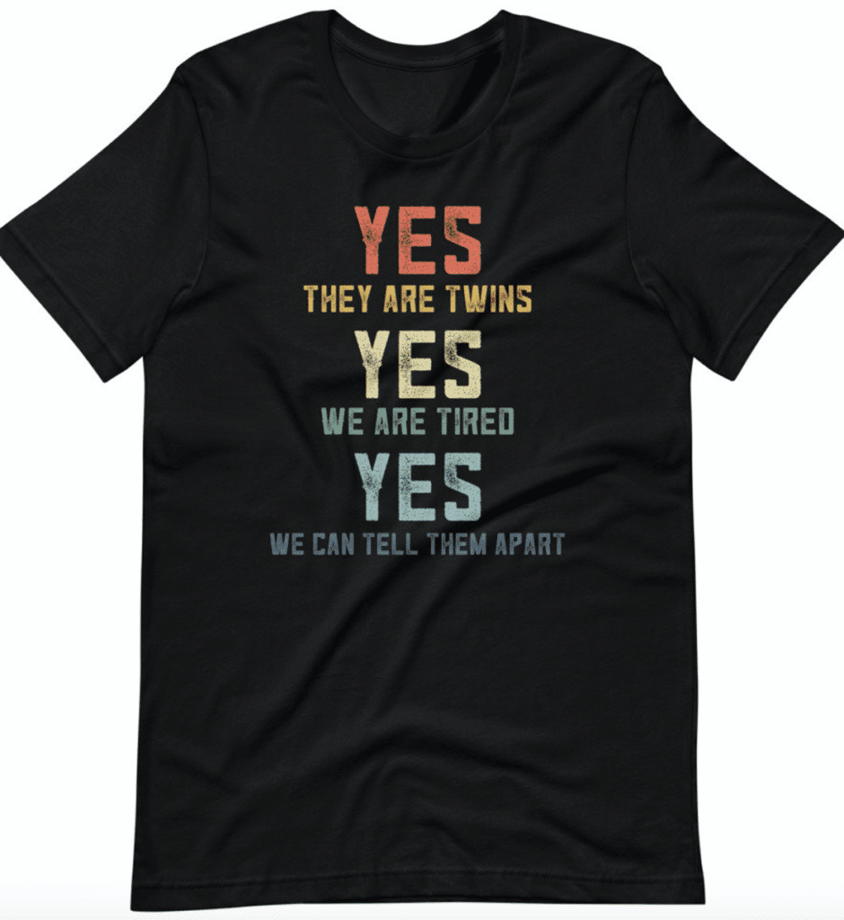 Black shirt with multicolored lettering reading "YES they are twins YES we are tired YES we can tell them apart."