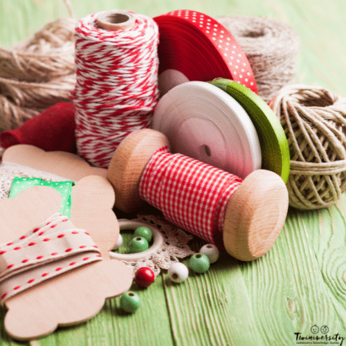 several spools of ribbon for a diy diaper cake.