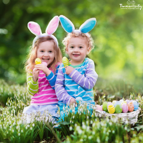two little kids in the grass with easter baskets for an easter egg scavenger hunt