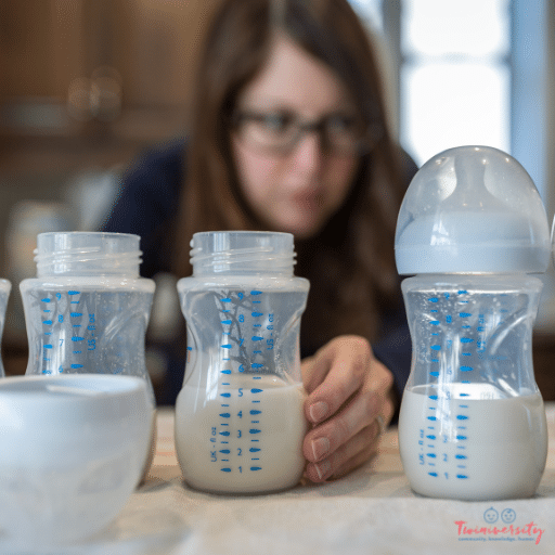 a woman out of focus measure formula into baby bottles for twin feeding hacks