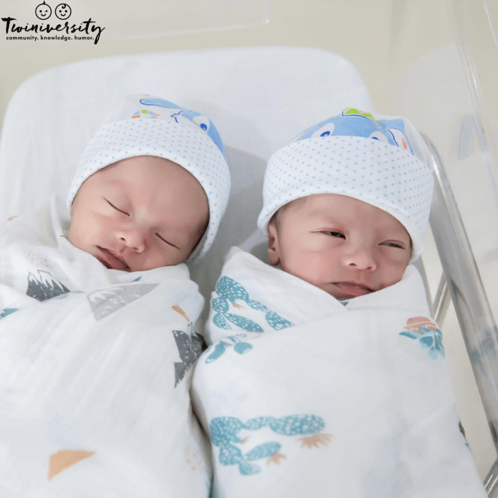 newborn twins sleeping together