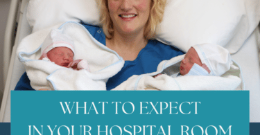 woman holding newborn twins in hospital room after delivery
