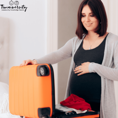 Pregnant woman packing her hospital bag to have in her hospital room after delivery