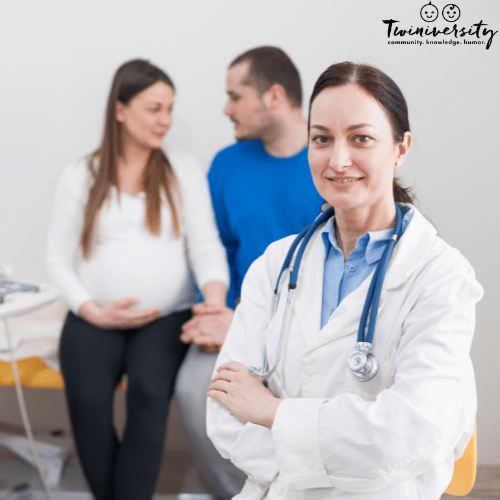 a doctor poses in front of her pregnant patient and her husband, part of their medical team during pregnancy