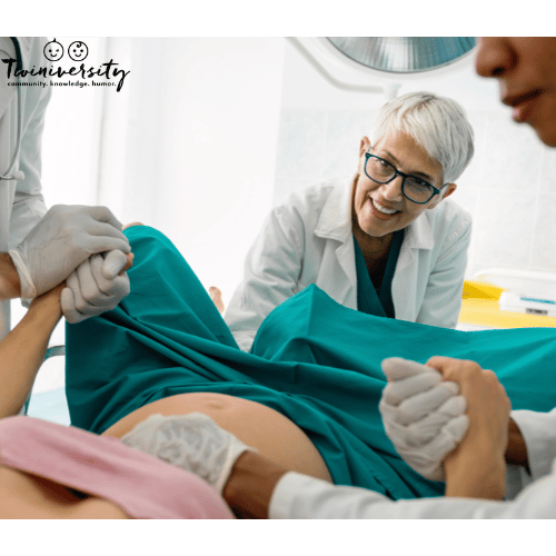 a doctor delivering a baby part of a medical team