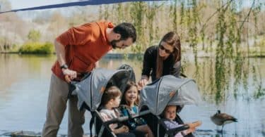 zoe triple stroller with family of triplets