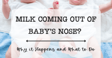 twin babies crying on a bed possibly due to milk coming of their noses