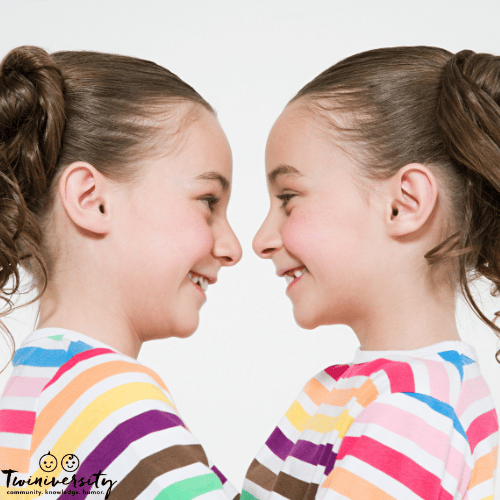 a unique type of twins are mirror twins pictured looking at each other