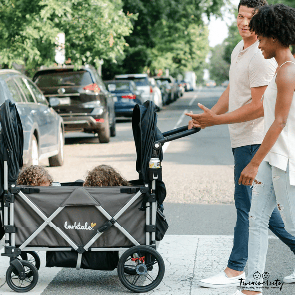 Family walking their kids in their Larktale Caravan Stroller