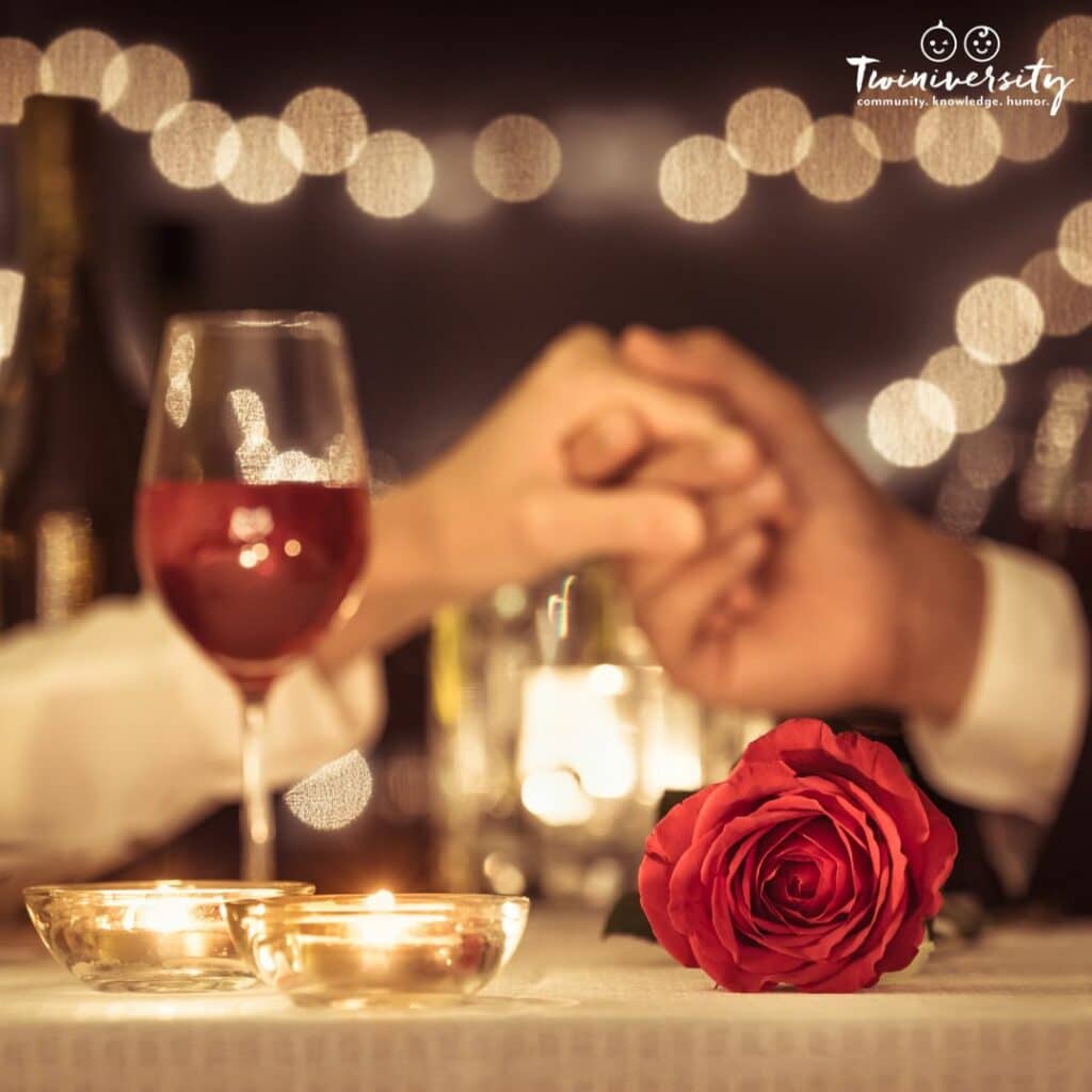 A couple holding hands making time for each other at dinner