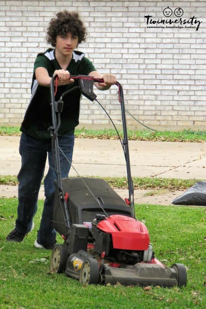 12 year old boy is mowing the lawn. This is a great chore and age appropriate