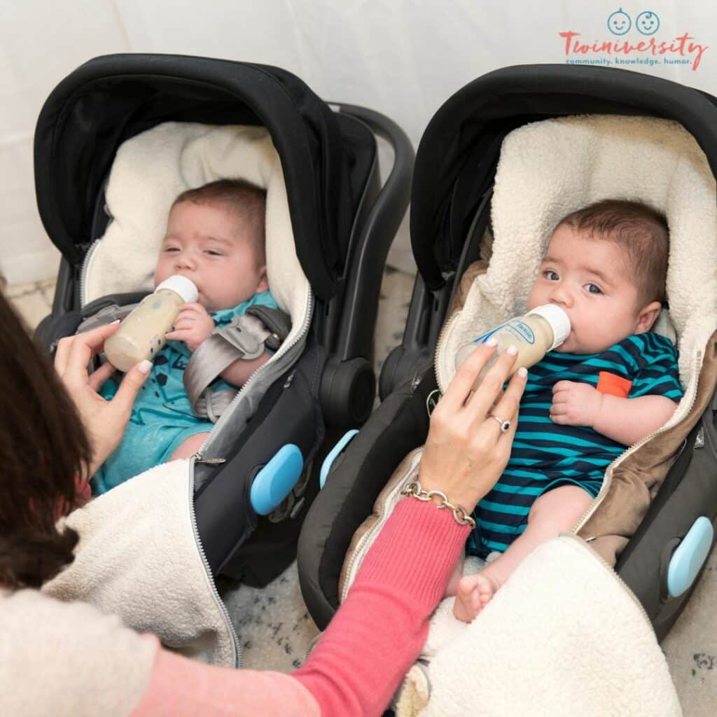 Twins being fed in the side-by-side position which is one of the best feeding positions for twins.