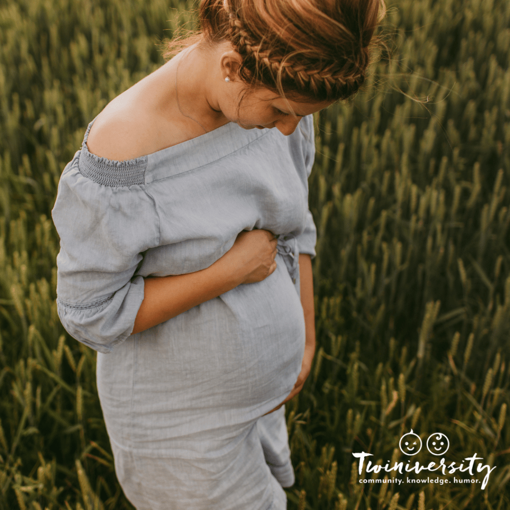 Pregnant woman holding her pregnant belly