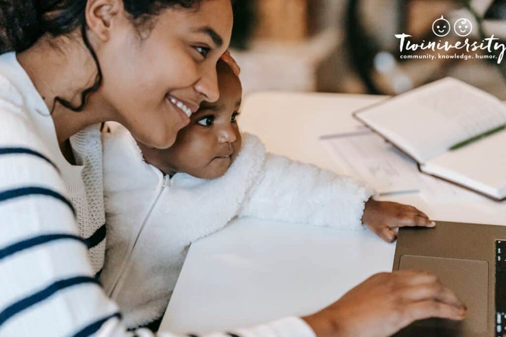 A mom working from home with her infant on her lap