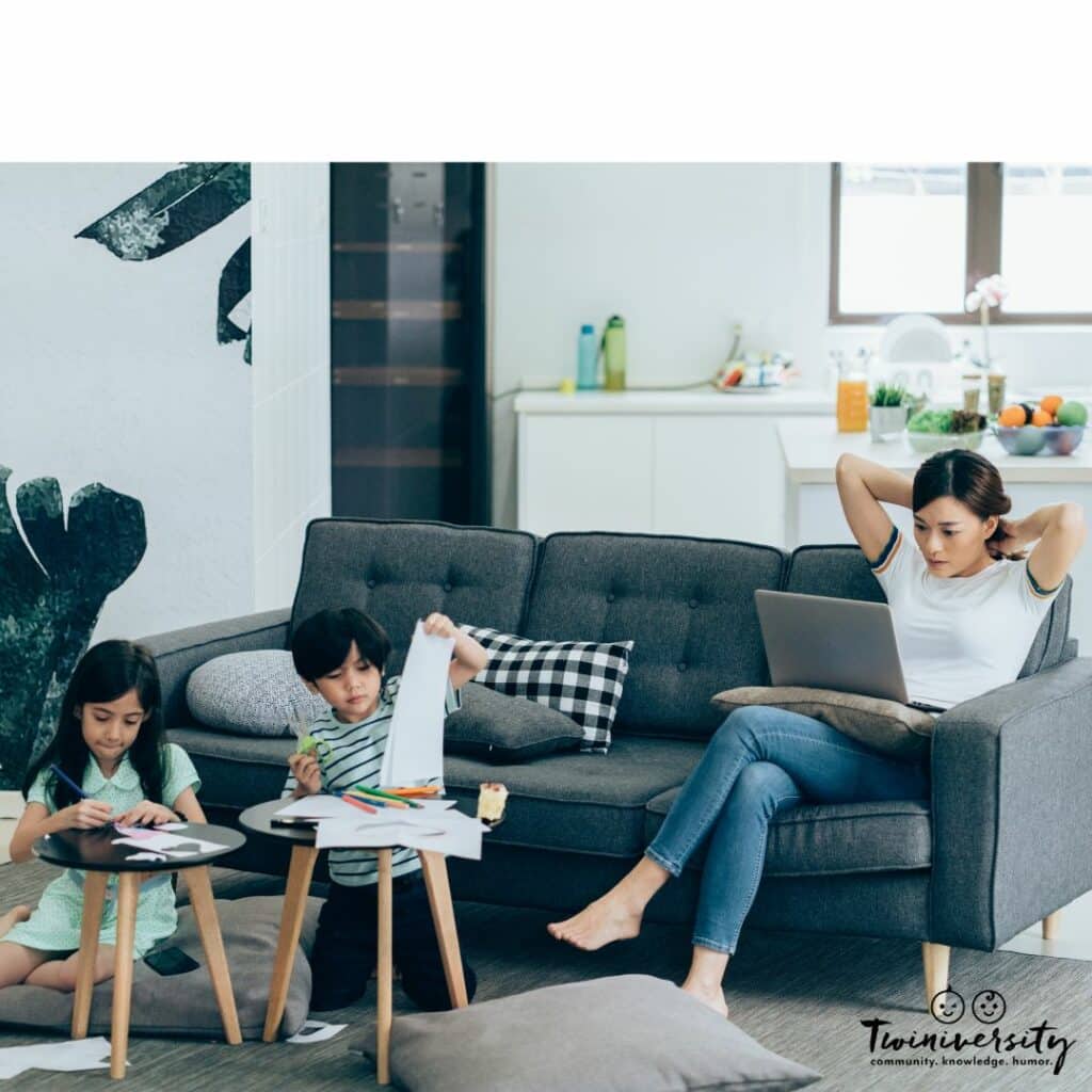 MoM working from home with her twins by her side. 