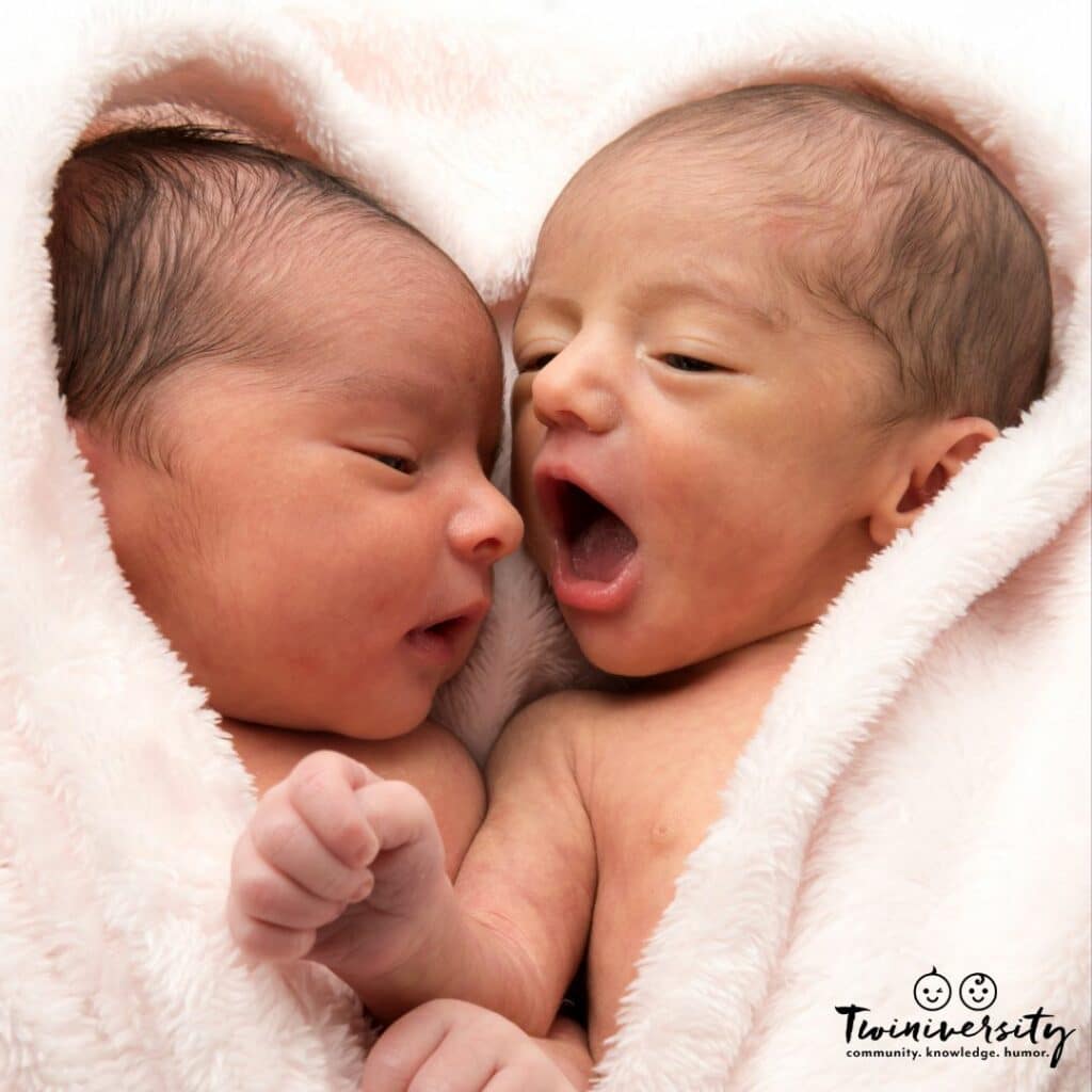 Twin Newborns snuggled together awaiting their skin-to-skin time.