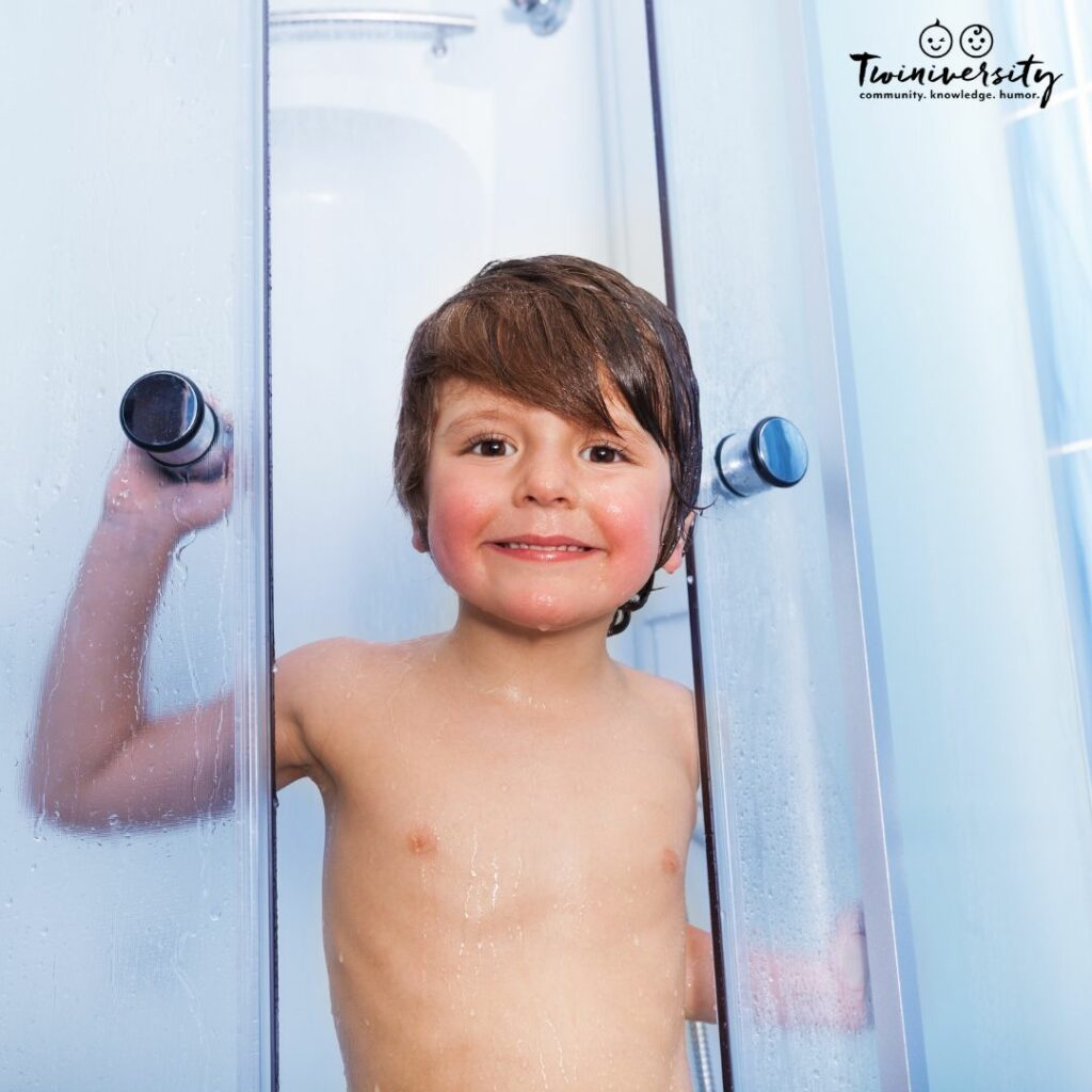 Young boy in the shower instead of the bath due to his fear of bathtime