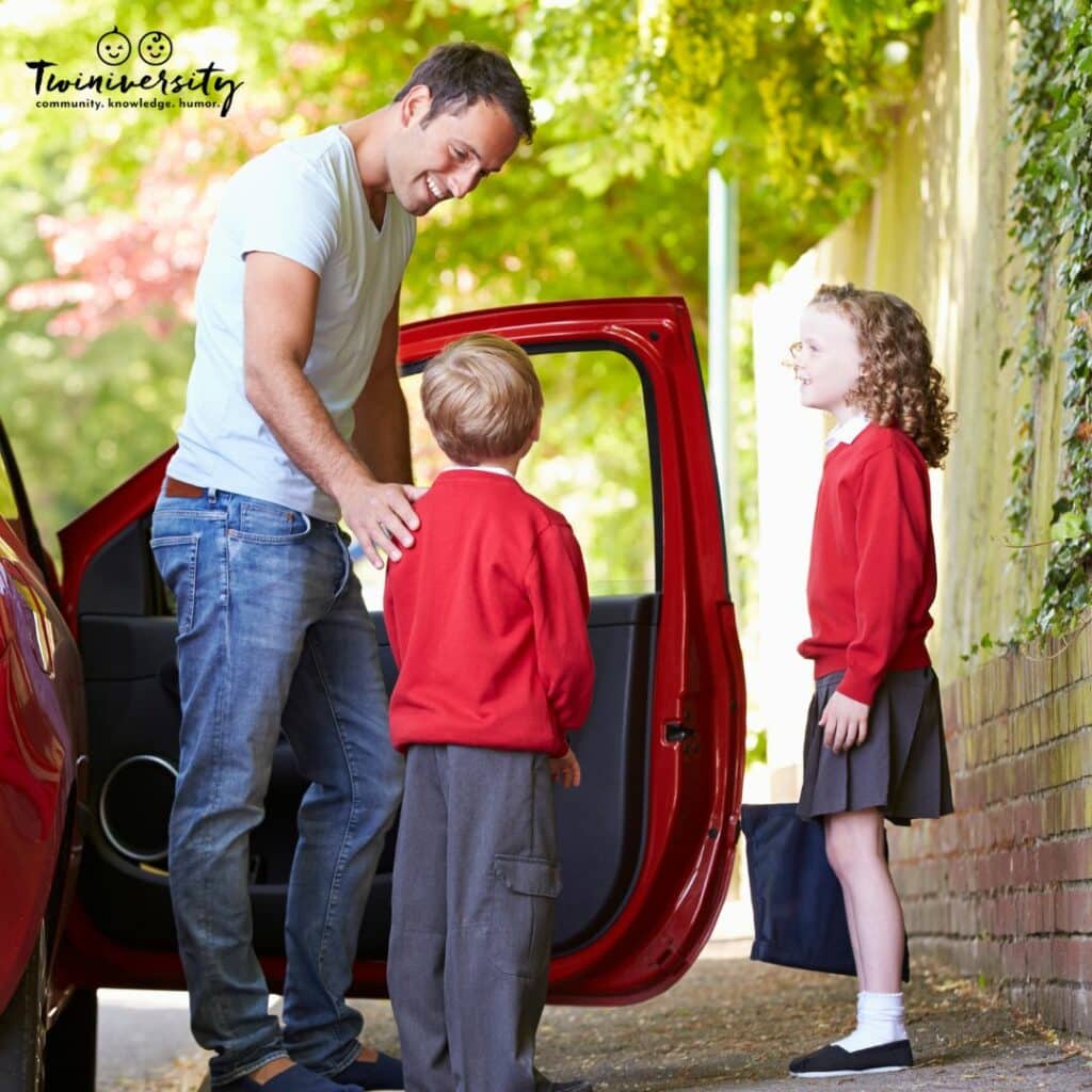 Twin boy and girl being dropped off at school by their dad.  Pickup and drop off decisions are important in kindergarten with twins
