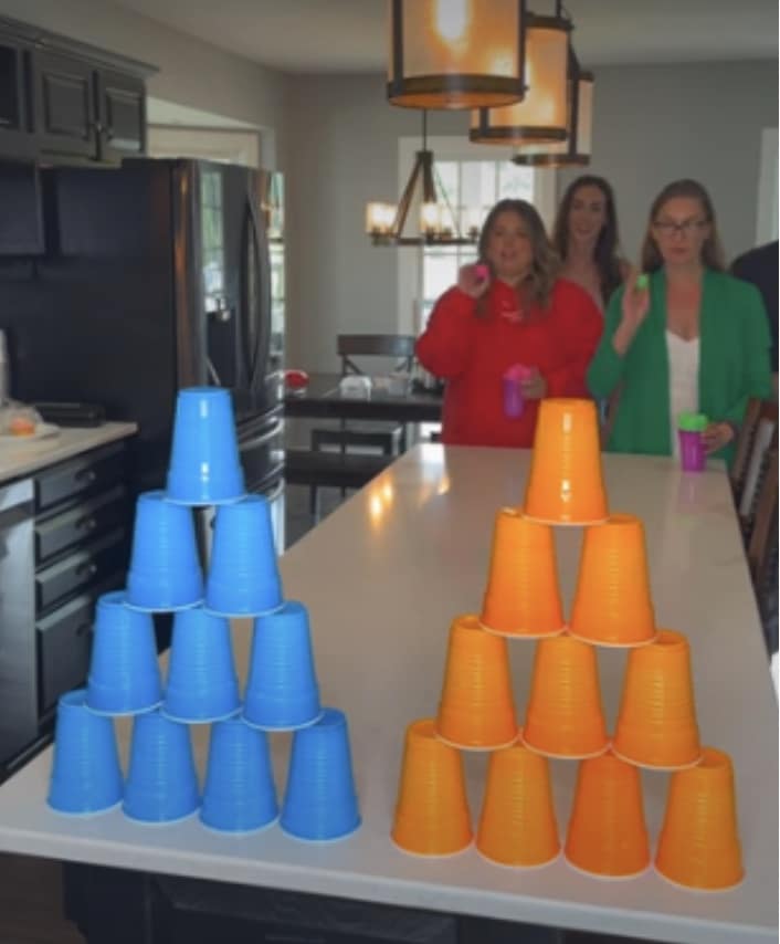 Knock out with plastic cups and ping pong balls is a fun activity on Thanksgiving day.