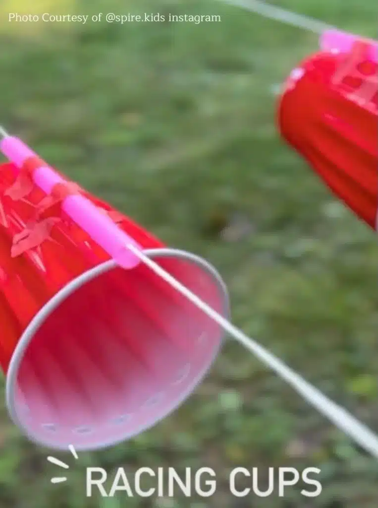 Squirt bottle races as twin toddler activities