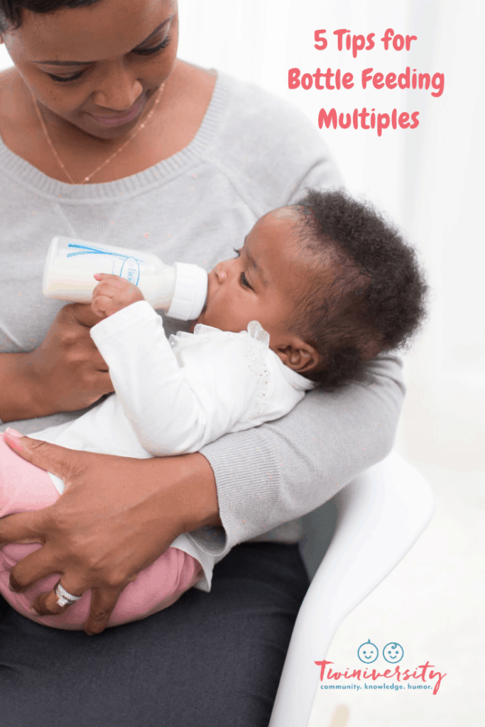 mom feeding baby with bottle feeding multiples