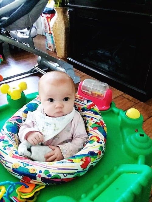 baby sitting in an exersaucer maternity leave