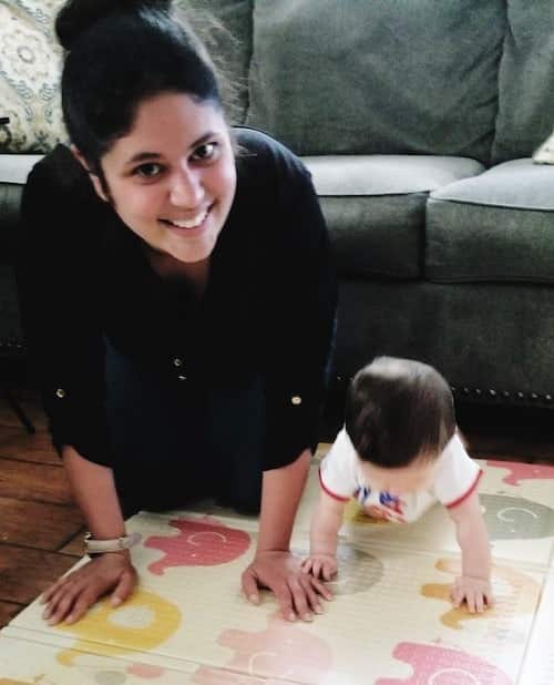 mom with baby on floor mat COVID-19 article