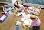 two girls playing in their room with quiet time boxes