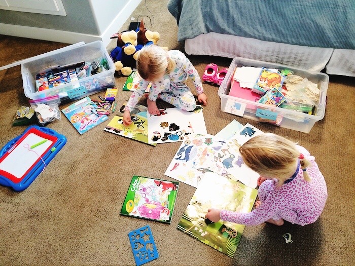 two girls playing in their room with quiet time boxes